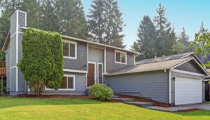 exterior of home with blue siding and new windows