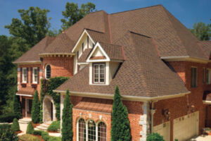large, mansion home with grey shingle roofing
